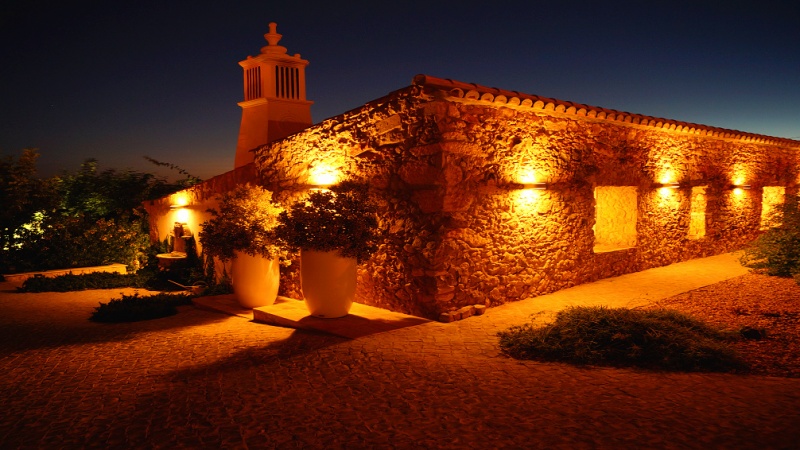 Guesthouse by night in the garden of